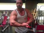 Conan Stevens Arms Flexed